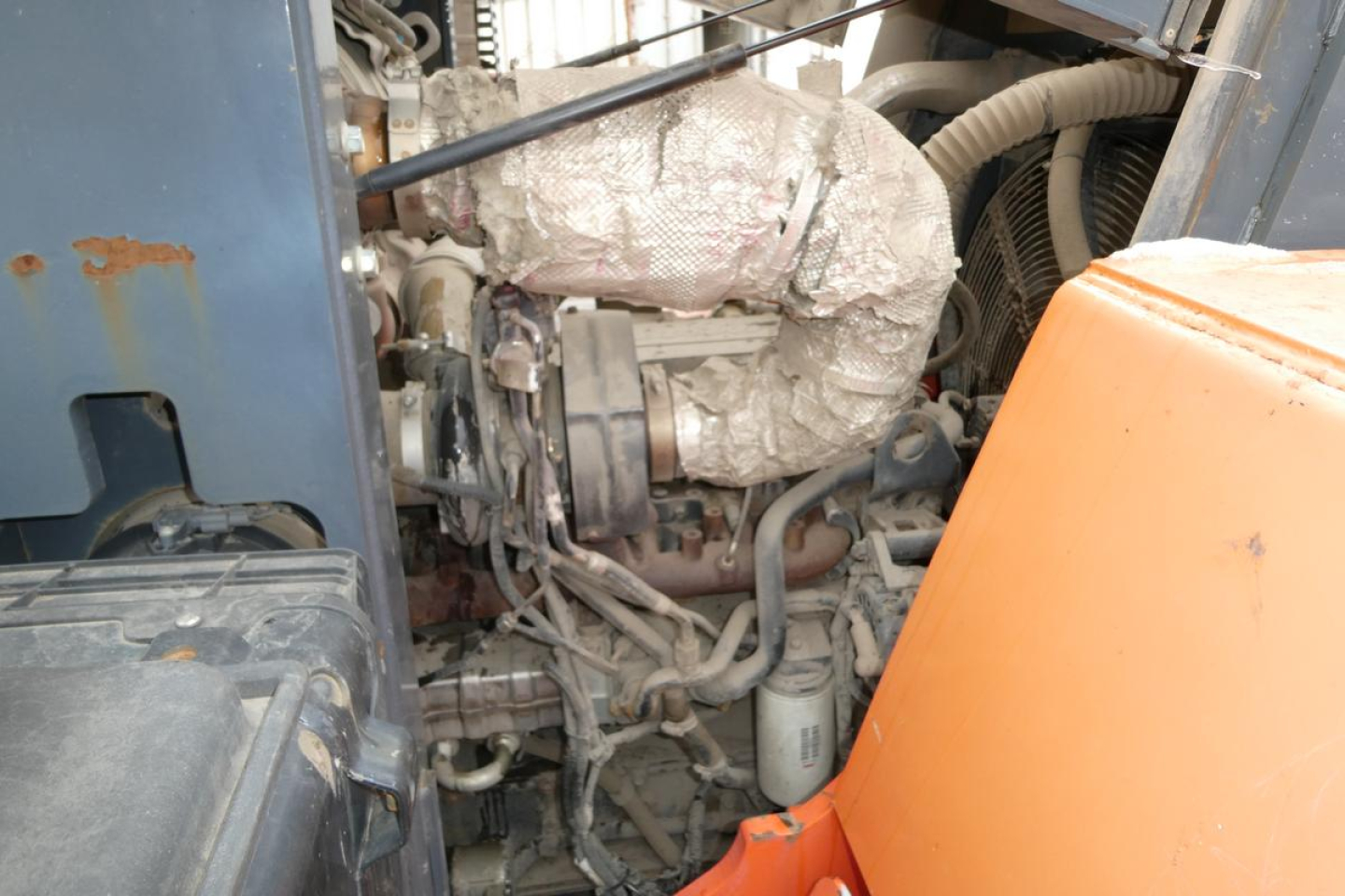 Truck engine bay view with Toyota THD3000-24 forklift lift. Visible components include engine block, hoses, air intake, exhaust wrap, coolant line, and white filter. Text seen includes VIN 100233 and stock number 0902252 on listing material