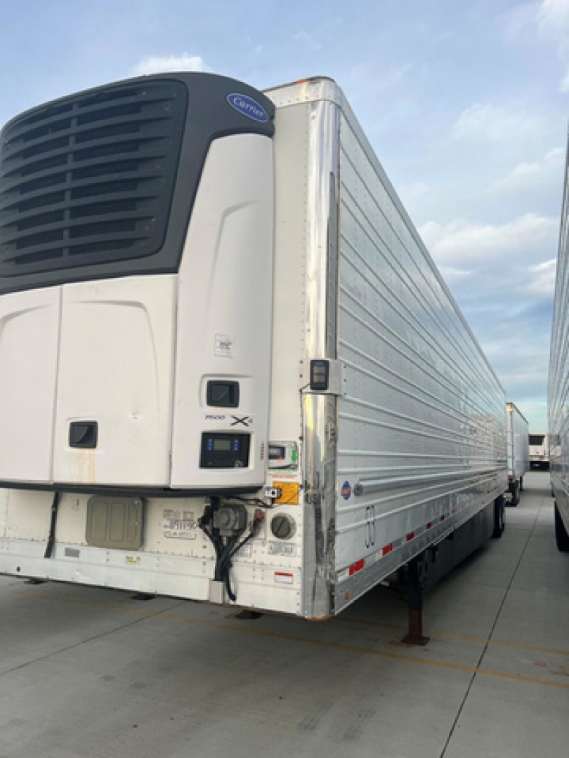 Trailer refrigeration unit on a 2021 Utility reefer trailer showing front-left view with cooling unit and side walls.