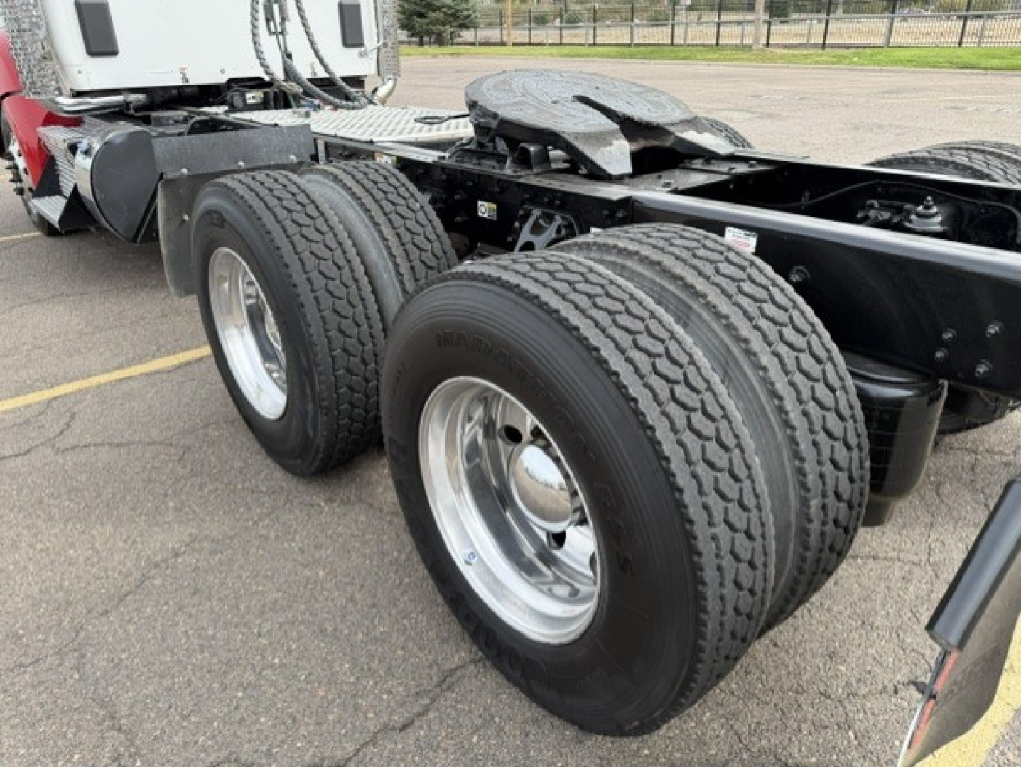 Kenworth T880 tractor dual rear tires and chassis with wheels and fenders visible.