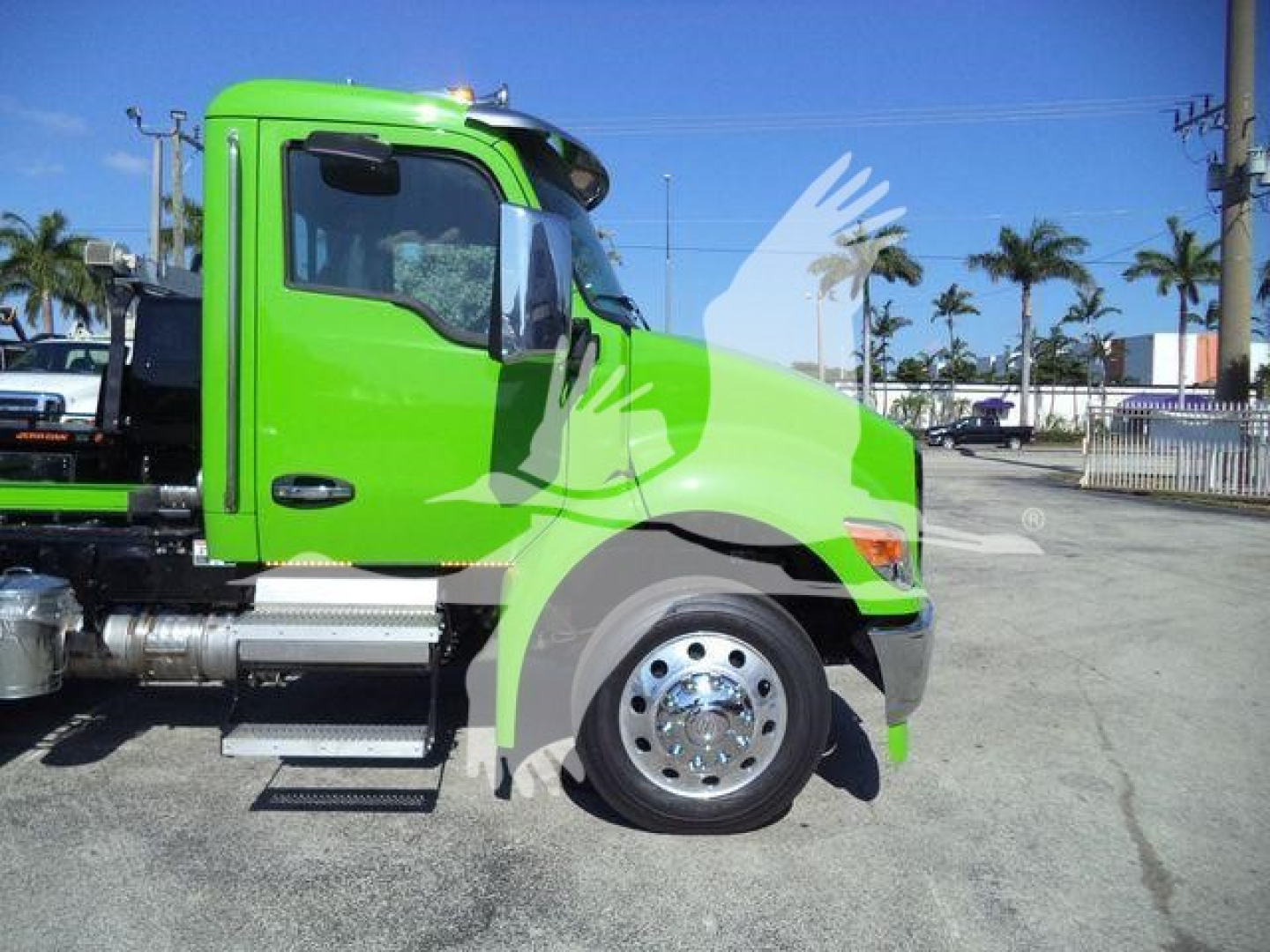 Kenworth T280 truck side profile showing bright green cab and chrome wheel, fuel tanks, and side steps.