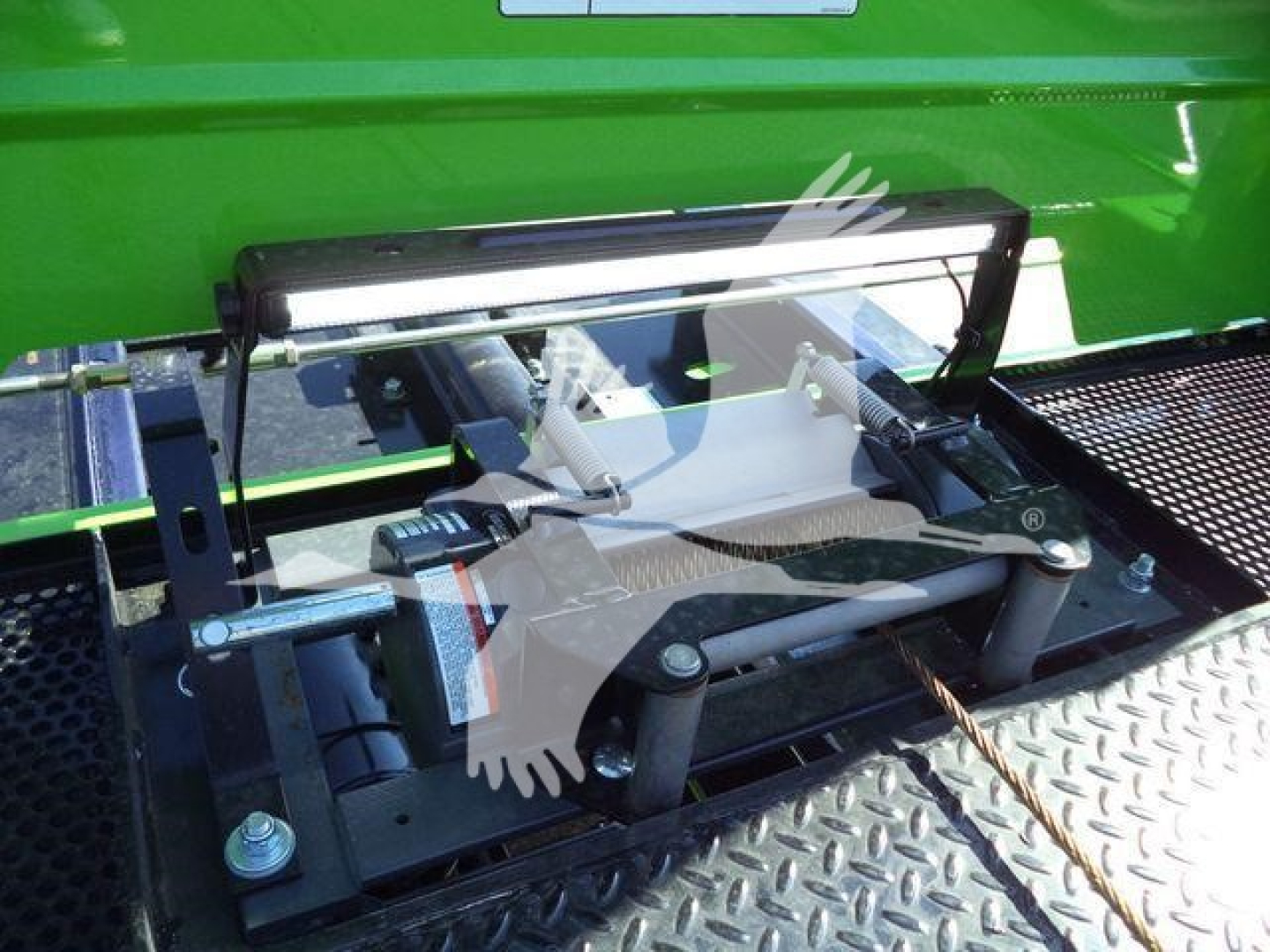 Kenworth T280 rollback equipment showing hydraulic lift mechanism and safety rail on bed edge.