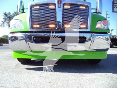 Front view of a green Kenworth T-series truck showing chrome grille and bumper; partial vehicle silhouettes overlaying the image.