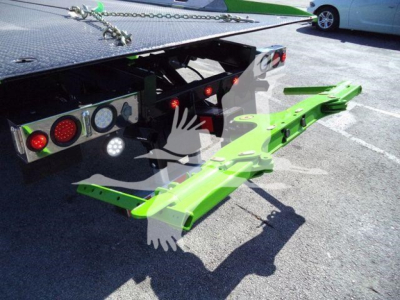 Kenworth T280 rollback truck with bright green removable wheel-lift arms extended from the rear; hydraulic and rear lighting visible; stock KW1STEPSIDE listing.