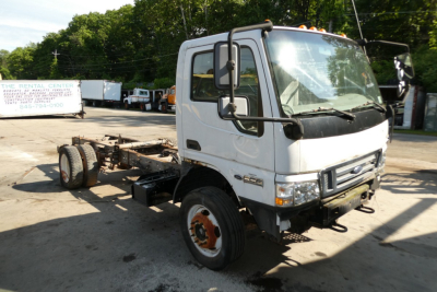 2006 Ford LCF cab and chassis truck front-left view with VIN plate and stock number visible on lot.