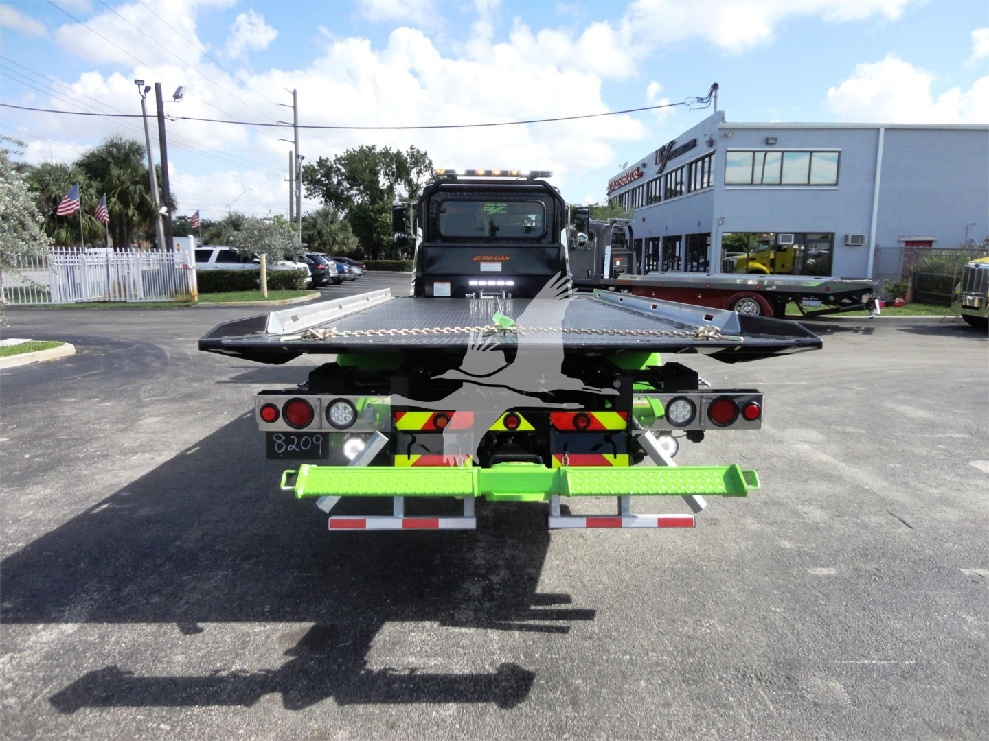Truck rear view showing rollback bed and equipment connectors on Peterbilt 337.