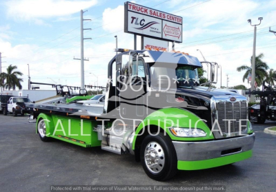 Peterbilt 337 rollback tow truck with green and chrome color scheme, stock number J56607, ’SOLD ALL SYSTEM’ watermark visible in lot.