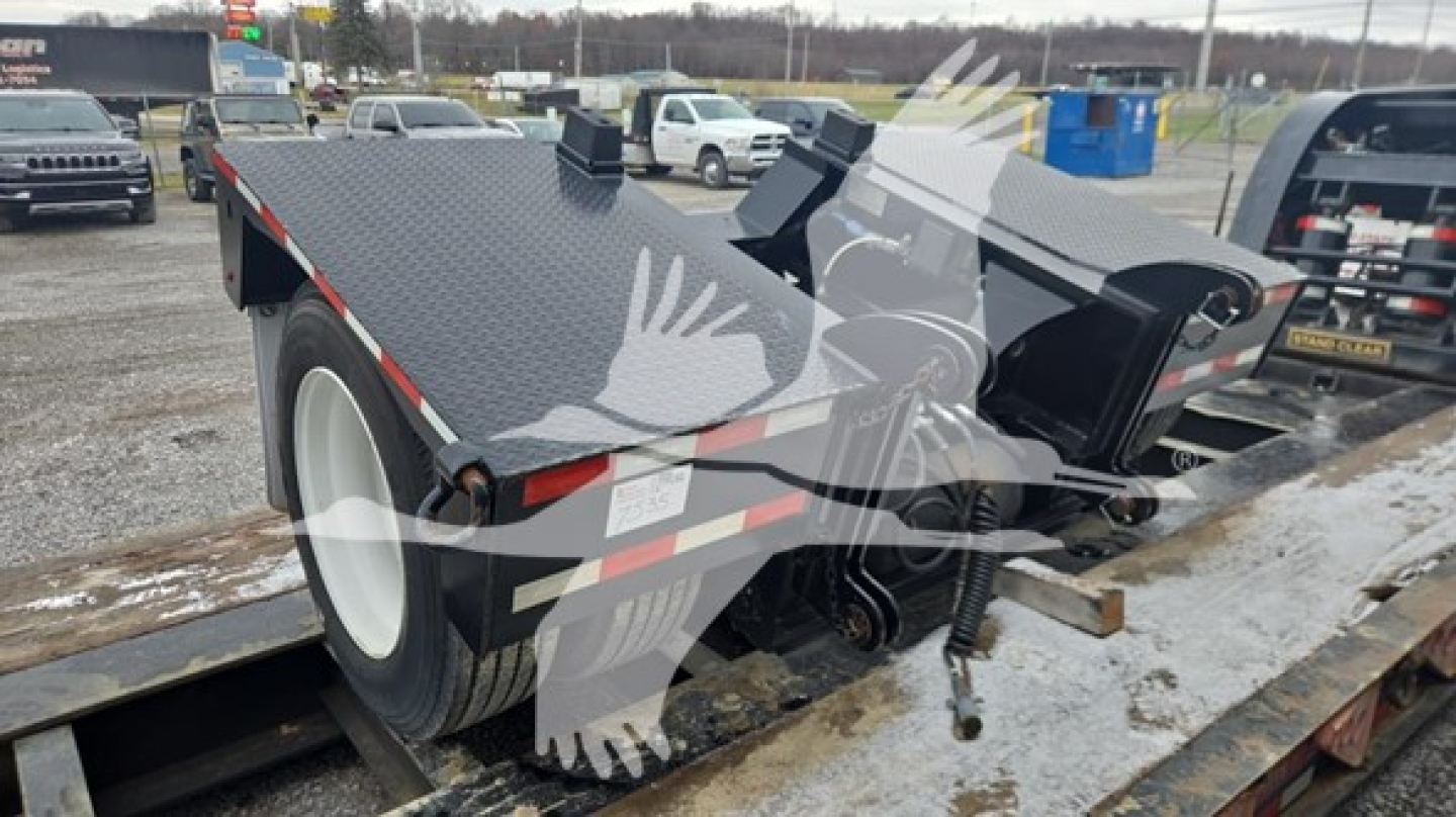 2021 Pitts LB55-18DC lowboy trailer showing loading deck, wheel, and hydraulic gooseneck components with steel textured surface.
