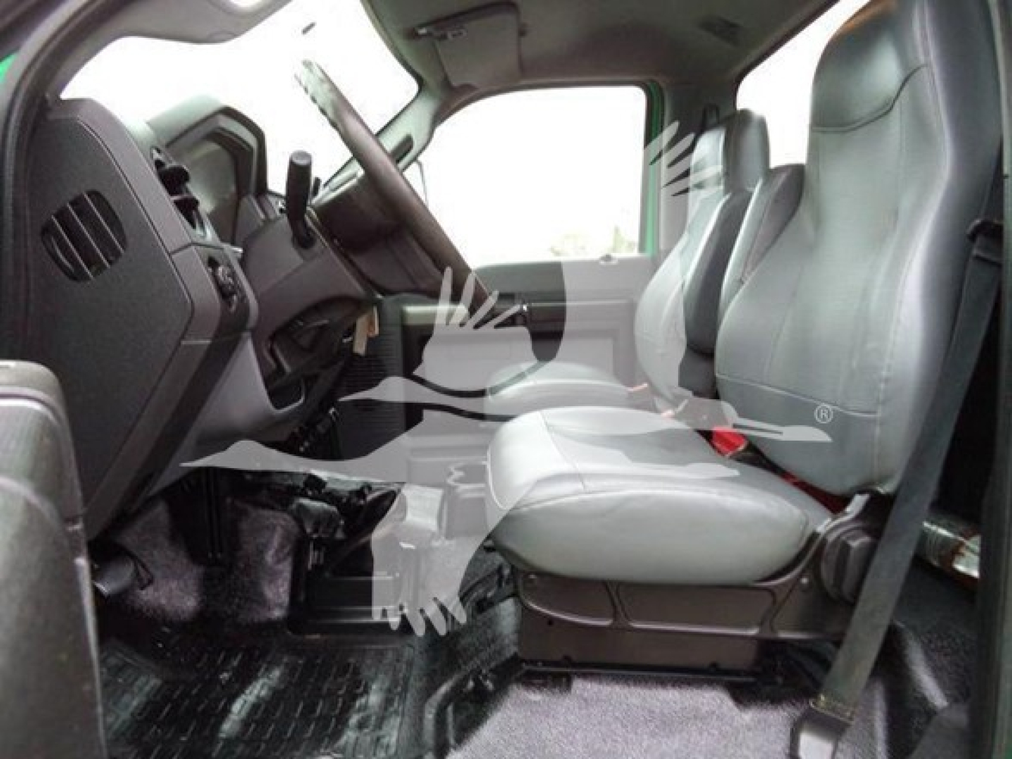 Ford F650 cab interior showing front seats and steering wheel.