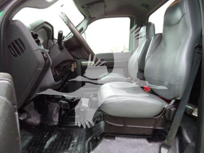 Ford F650 cab interior showing front seats and steering wheel.