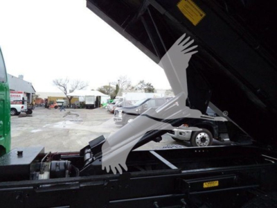  Ford F650 dump truck side view showing hydraulic dump bed and chassis components.