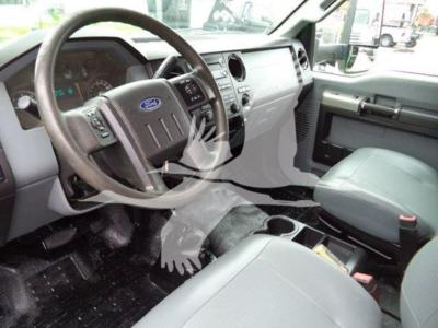 Ford F-650 interior cabin steering wheel and dashboard view showing driver-seat area and center console.