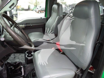 Ford F650SD interior front seats and dashboard showing steering wheel and driver's seat