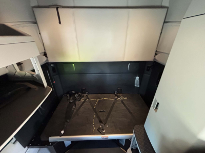 Kenworth T680 sleeper cab interior cargo area with seat belts and storage compartments visible