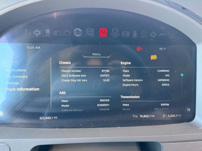 Kenworth T680 dash display showing chassis and engine details panel with numbers and alerts.