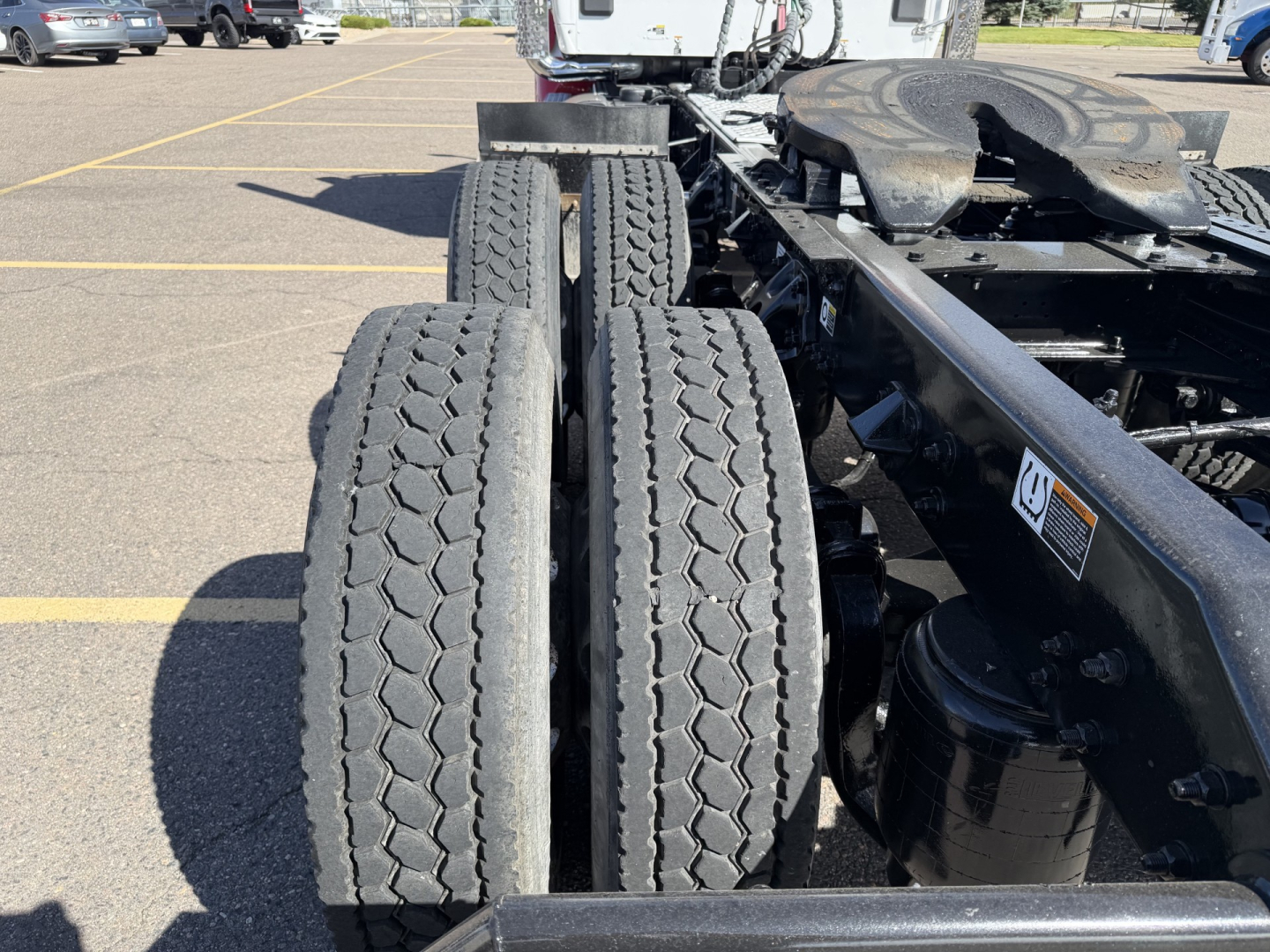 Kenworth T880 chassis rear dual tires view showing drivetrain and frame with no cab.