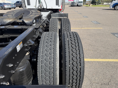 Kenworth T880 chassis showing dual rear tires and frame with basic components visible