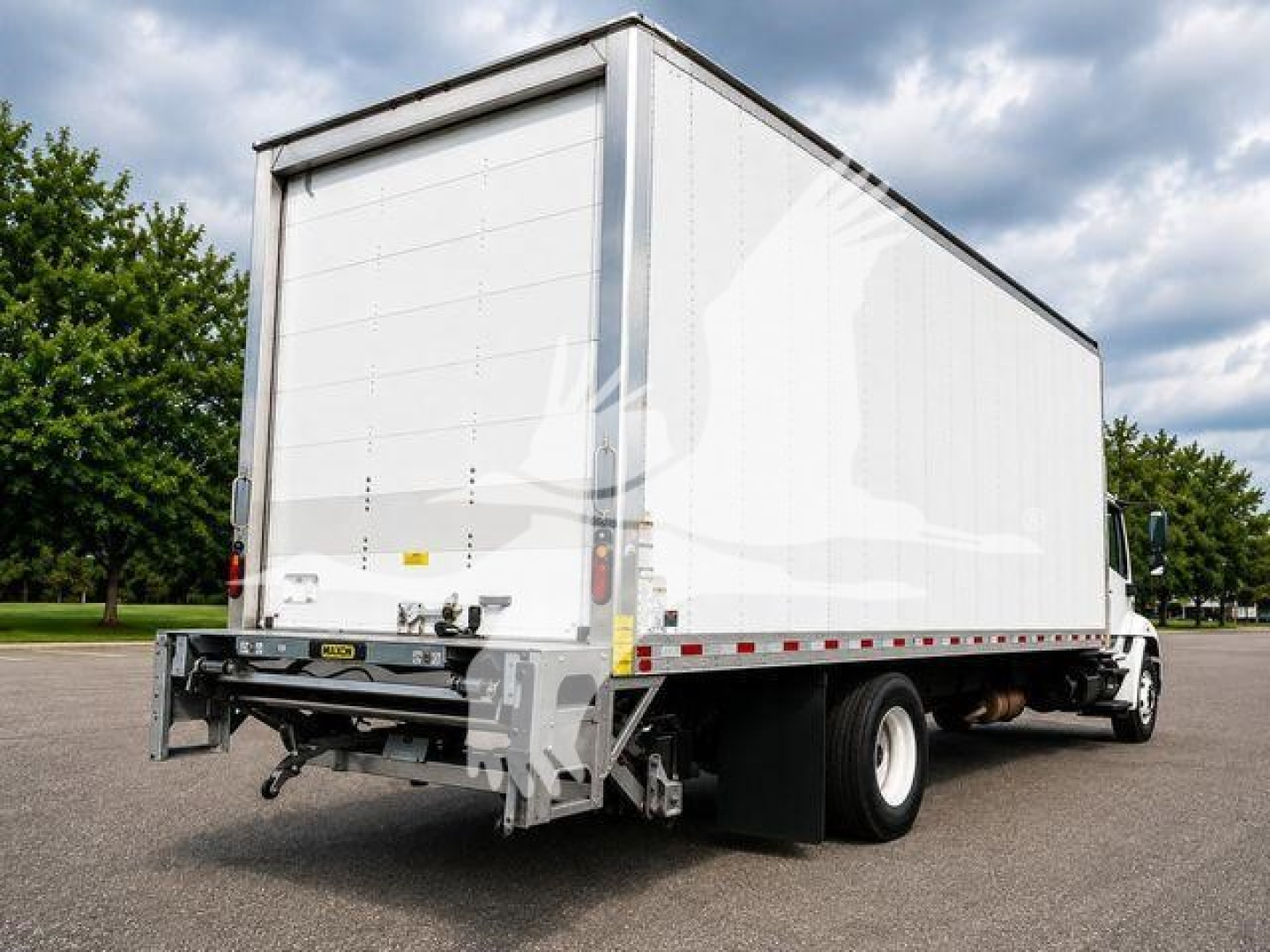 Box truck rear-left view showing cargo box and rear underrun protection.