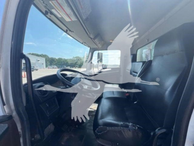 Cab interior of a 2023 Hino L6 truck showing steering wheel, driver seat, and dashboard.