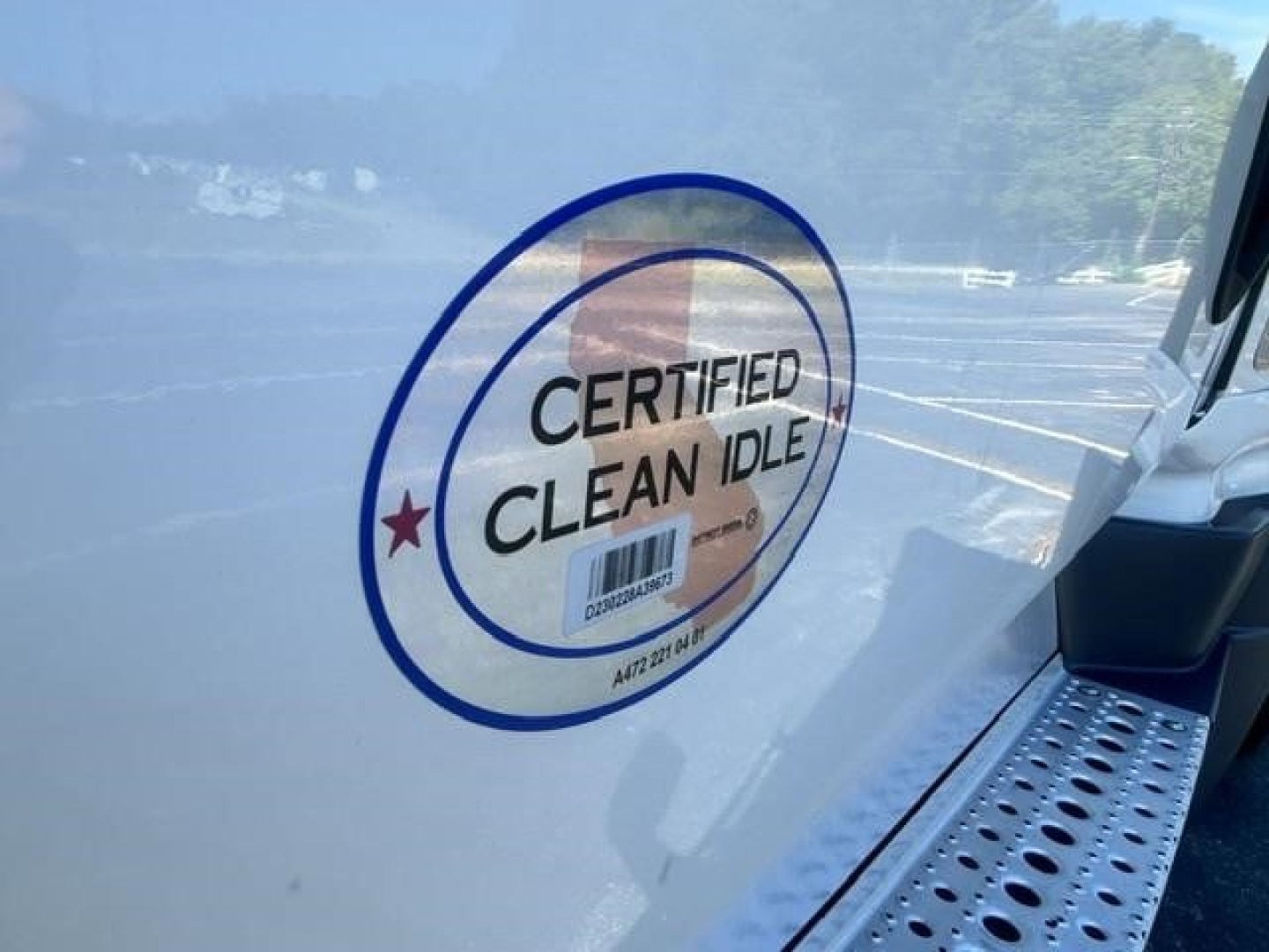 Freightliner Cascadia 126 side with Certified Clean Idle badge sticker visible on door area.