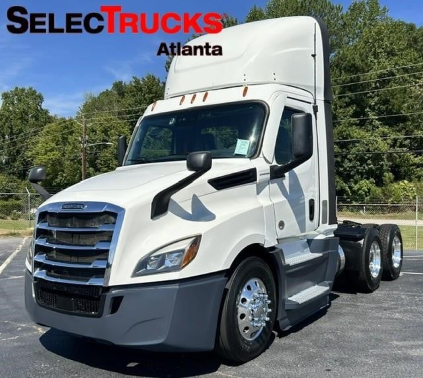 Freightliner Cascadia 126 day cab truck in white, front three-quarter view with SelectTrucks Atlanta branding overlay.