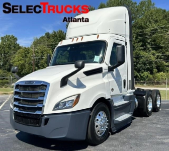 Freightliner Cascadia 126 day cab truck in white, front three-quarter view with SelectTrucks Atlanta branding overlay.