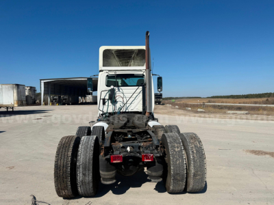 Truck chassis of a 2015 International Prostar LA687 rear view showing dual rear axles and tire stack.