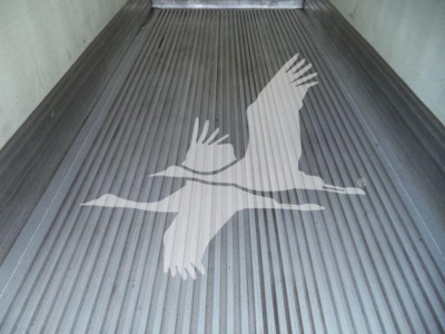Truck bed with Grooved flooring and a large white bird logo (refrigerated truck) visible in the image.