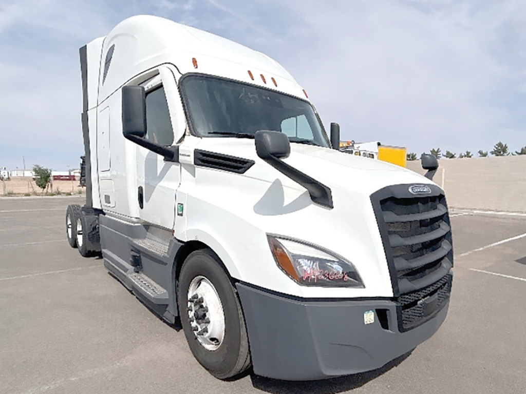 White Freightliner Cascadia126 tractor in a parking lot with sleeper cab and black grille.