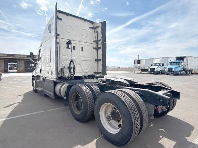 2023 Freightliner Cascadia126 tractor rear view showing sleeper cab, twin rear axles, and fifth wheel beneath; VIN and stock info not visible in image.