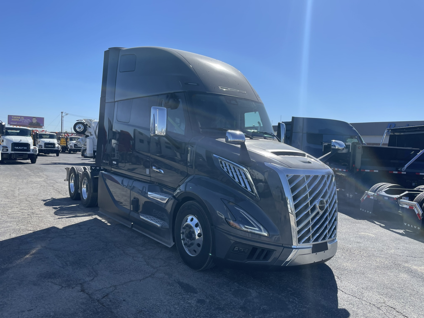 Volvo VNL64T860 tractor-trailer cab in profile view showing aerodynamic sleeper and front grille.