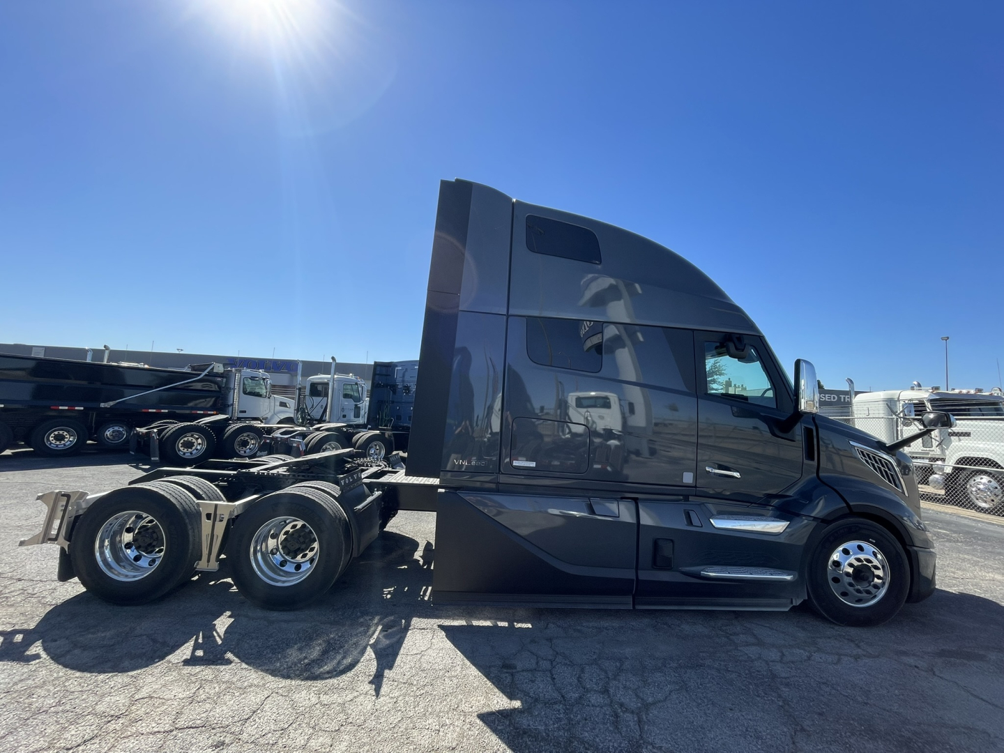 Volvo VNL64T860 truck side view showing sleeper cab, chassis, and rear wheels.