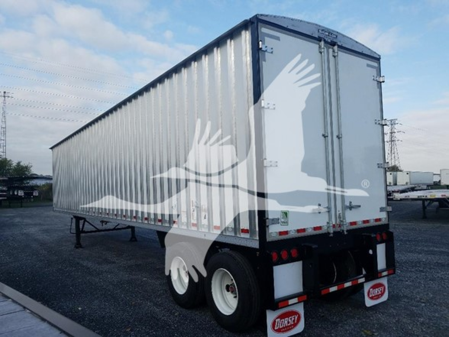 Dorsey walking floor trailer rear view showing vertical corrugated metal walls and rear doors, VIN sticker not visible, stock blade VED48297.