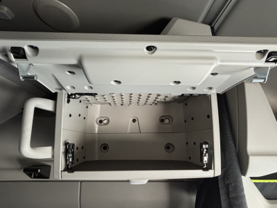  Volvo VNL64T860 engine bay storage compartment open with locking latches and interior panel