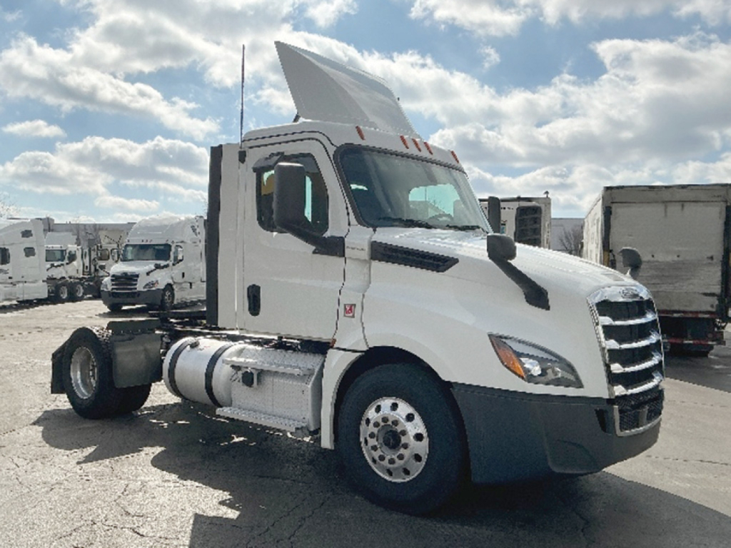 Truck engine bay not visible; side view of a white Freightliner Cascadia126 daycab truck with sleeper not present, fuel tanks, and front grille.