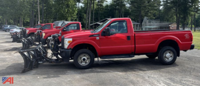 Ford F-250 Super Duty pickup with plow attachment mounted on front, red color, side view.