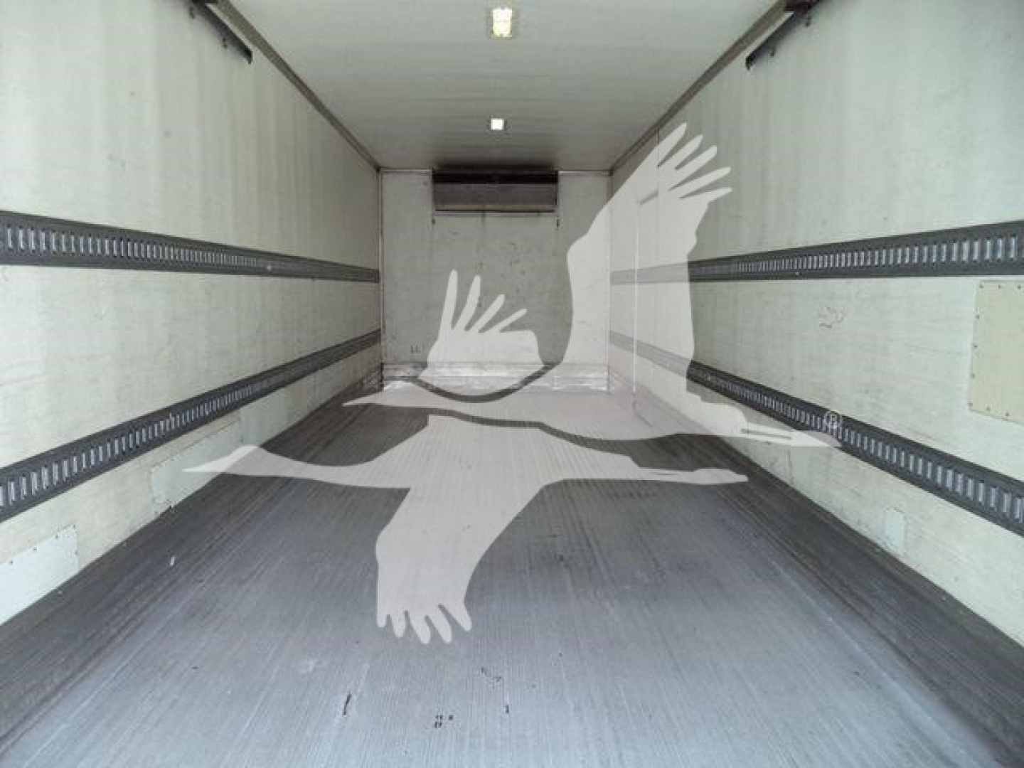 Interior of a Freightliner M2 106 box truck cargo area showing empty trailer with rubber flooring and side E-track rails.