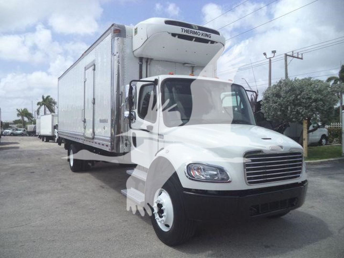 Freightliner M2 106 box truck with Thermo King reefer unit mounted on cab, side view showing cargo box and front grille.