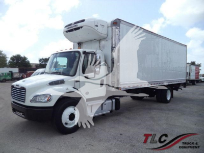 Freightliner M2 106 box truck with refrigeration unit on cab, side view showing the cargo trailer and wheel tires.