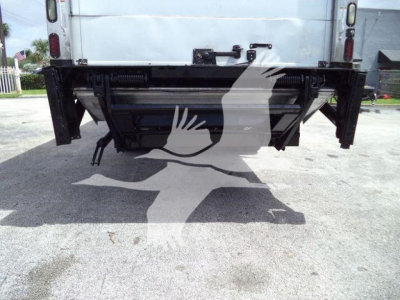 Freightliner M2 106 rear view showing undercarriage and hitch area with stock number 268304RFM label.