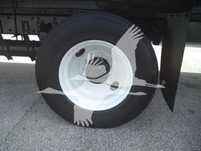 Truck wheel on Freightliner M2 106 used box truck showing white steel rim and black tire