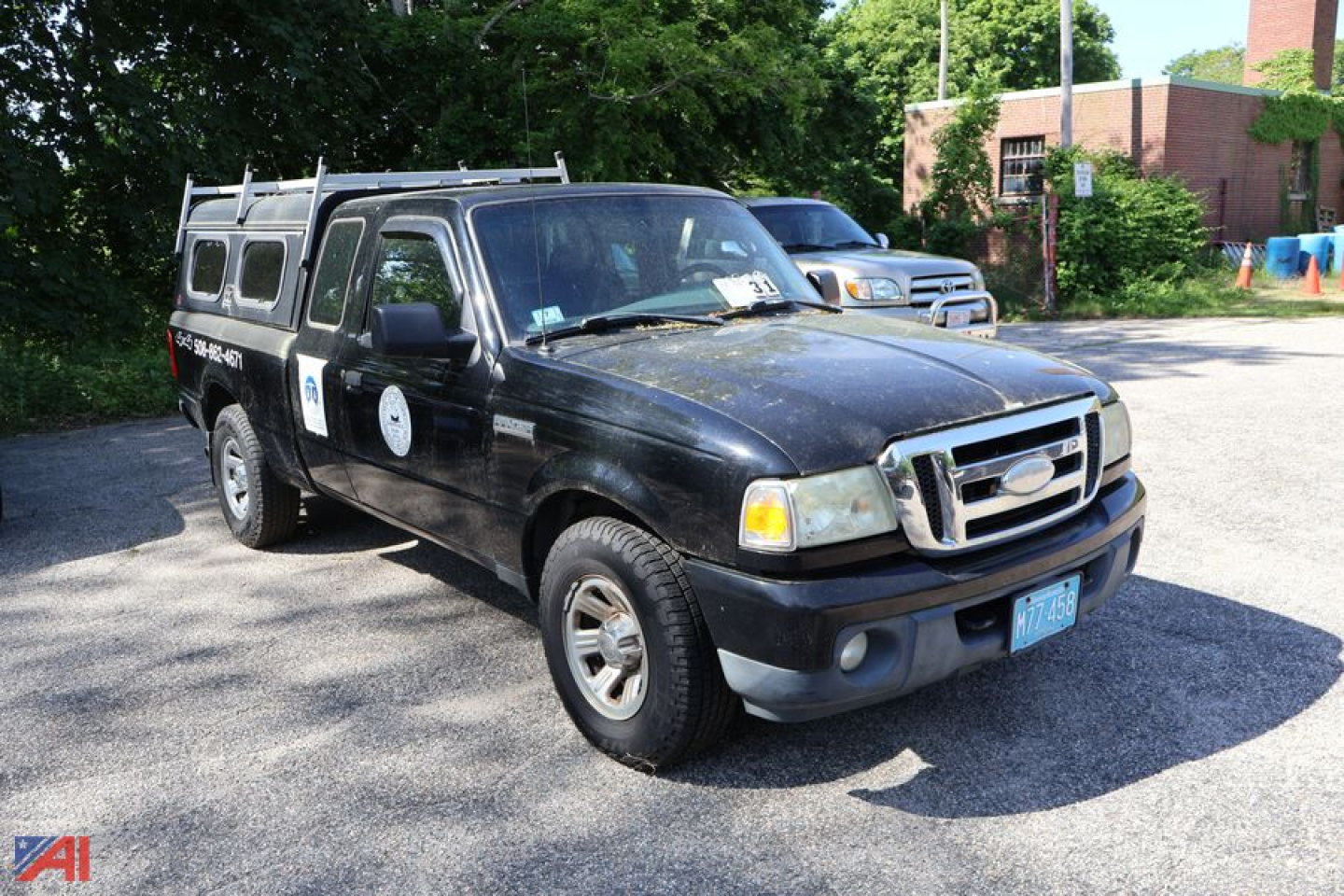 2008 Ford Ranger pickup truck in a used condition with black body, extended cab, and chrome front grille, parked outdoors.
