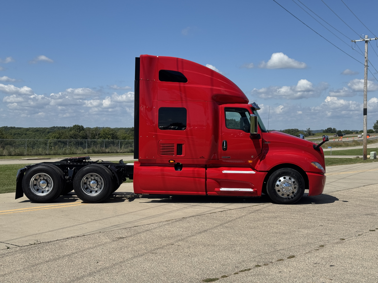 Red 2019 International LT625 conventional sleeper truck side view showing cab and chassis
