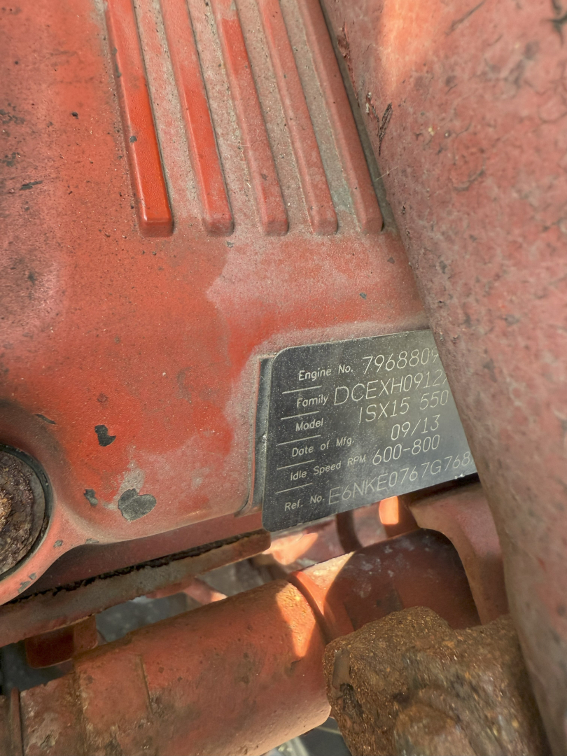 Kenworth T660 engine bay view showing engine model and specs plate with serial and engine numbers.