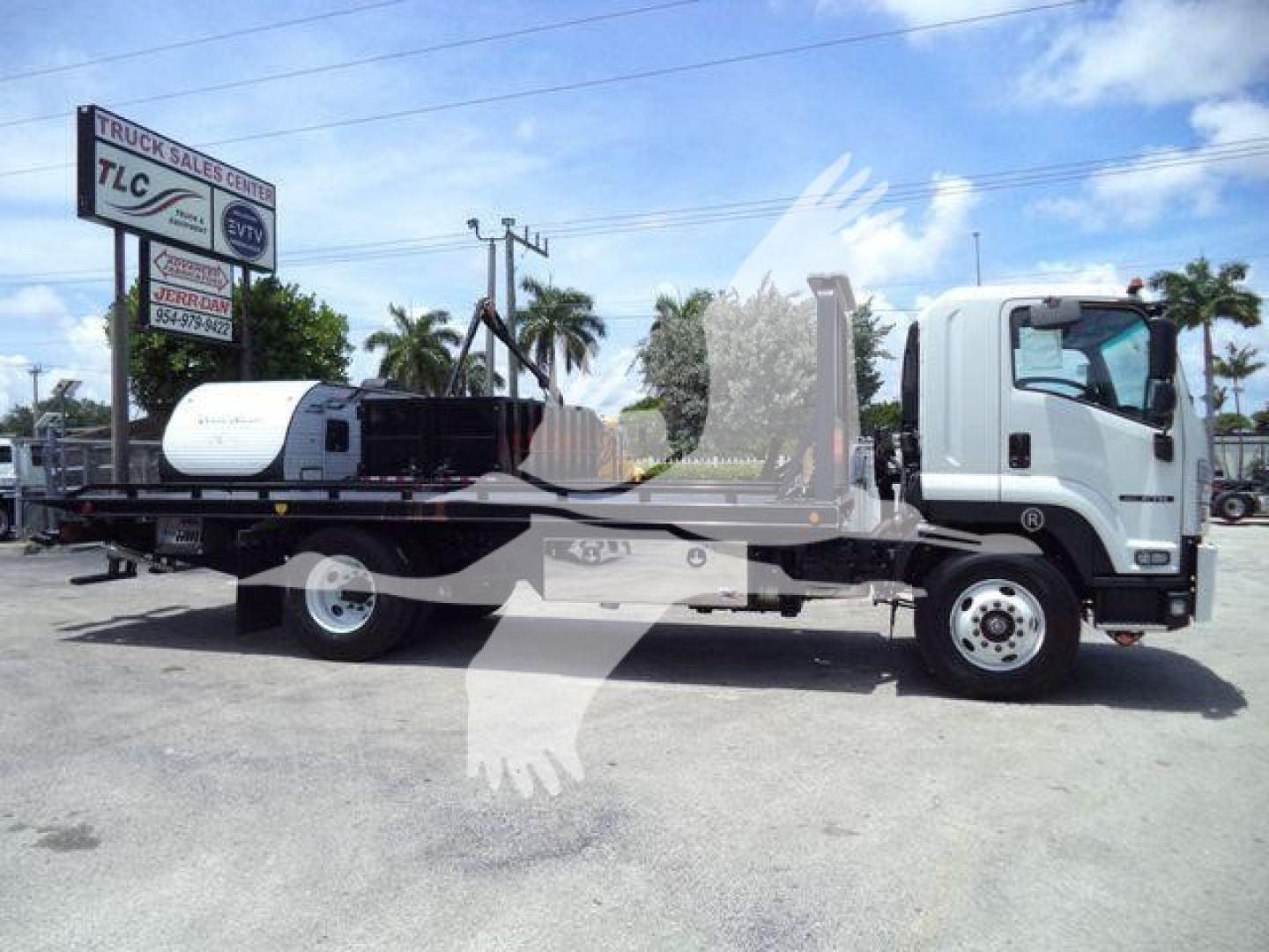 Isuzu NPR Tow Truck platform with rollback bed and flatbed, side view