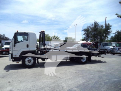 Isuzu Tow Truck flatbed cab view showing side profile and long flatbed.