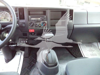 Isuzu FTR interior showing dashboard with steering wheel, center console, climate controls, and gear shifter.