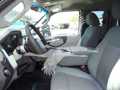 Interior of a Ford F-450 XL T series cabin showing front seats, steering wheel, and dashboard. No visible labels or fluids.