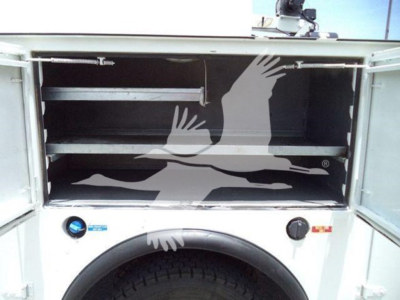 Service/Utility truck bed showing empty compartments and shelves