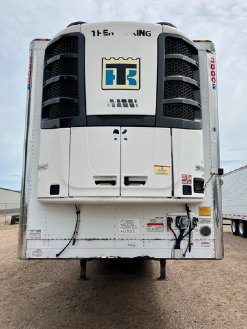 Refrigerated trailer rear view showing Thermo King unit with TT logo and integrated cooling system.