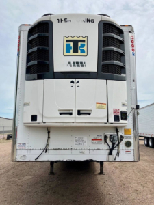 Refrigerated trailer rear view showing Thermo King unit with TT logo and integrated cooling system.